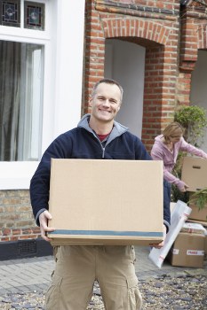 Packed moving boxes and wrapping materials prepared for a Brentford home move