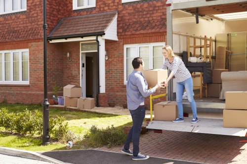 Movers handling urgent same day removals in Brentford on a residential street