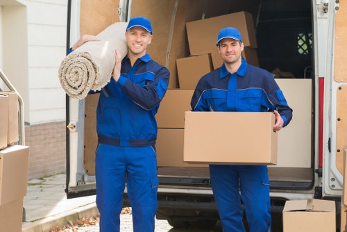 Moving team handling boxes safely during a man and van job