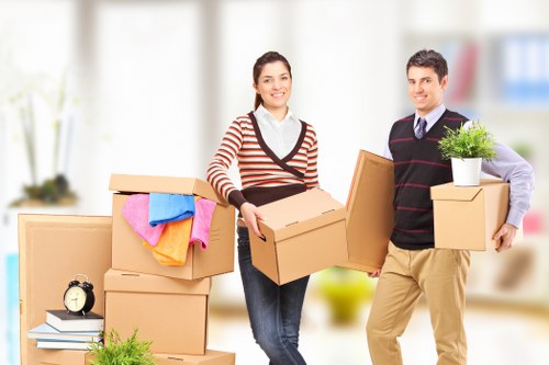 Professional movers loading items safely into a removal vehicle